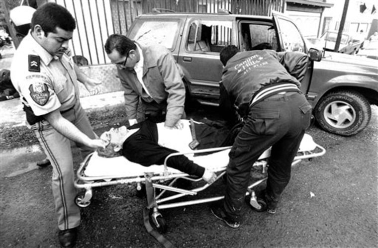 In this Nov. 27, 1997 photo, Jesus Blancornelas, one of the founders of Mexican weekly magazine Zeta, is aided after gunmen tried to kill him in Tijuana, Mexico.  Zeta magazine has set a standard for aggressive coverage of Mexican drug traffickers and complicit government officials. As the Inter American Press Association gathers next week in San Diego, Mexico's news organizations are increasingly under assault for covering a drug war that has claimed more than 35,000 lives, including at least 22 journalists, since the government launched an offensive against the cartels in late 2006. (AP Photo/Semanario Zeta)